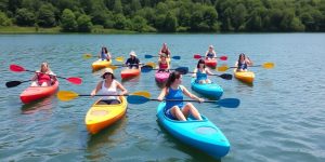 Group of kayakers on a calm lake surrounded by nature.